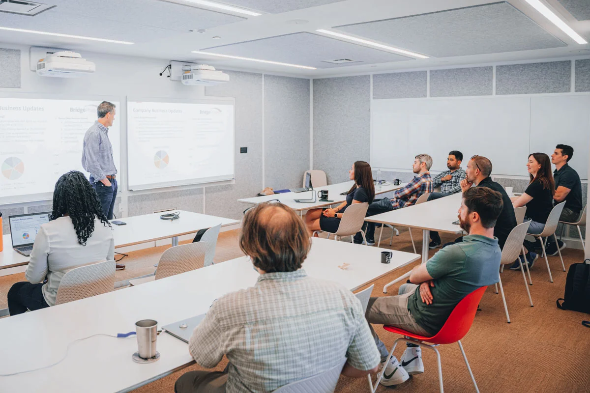 BridgePhase employees at a company meeting