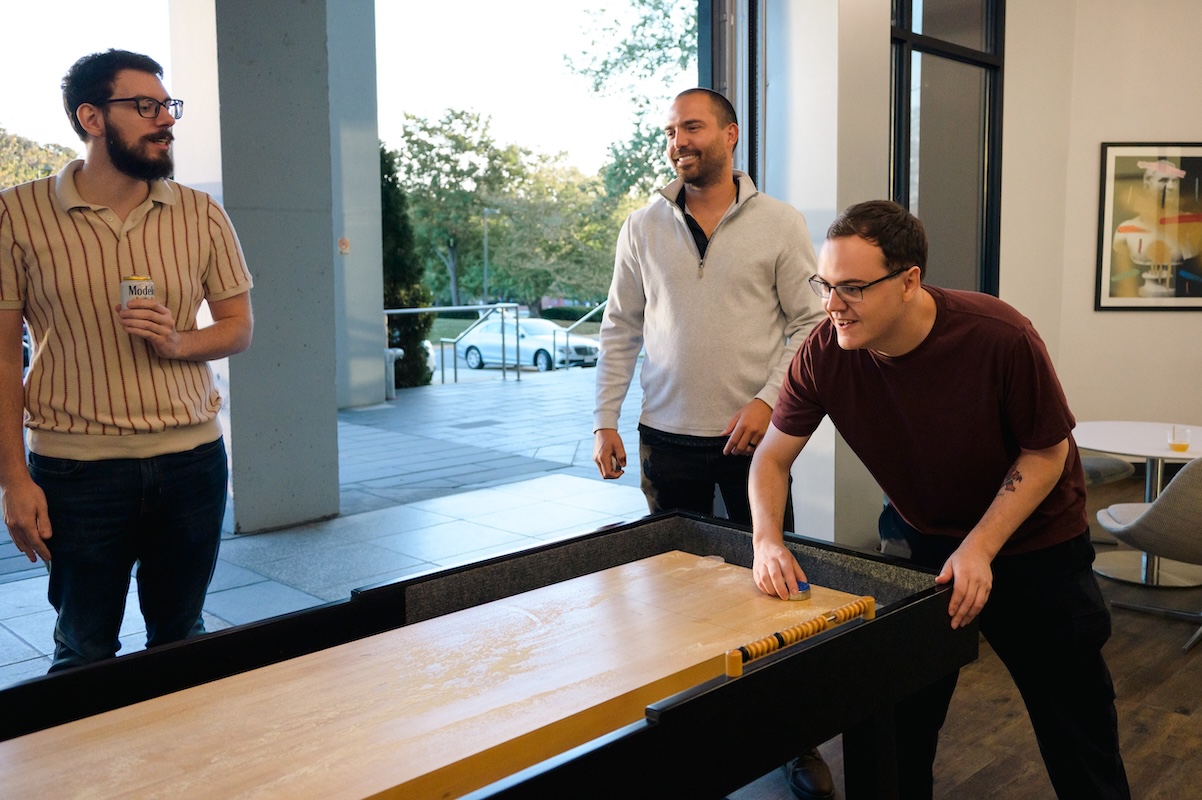 Table Shuffleboard at the October 2025 All-Hands Happy Hour